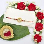 Elegant Rakhi with Floral Centerpiece