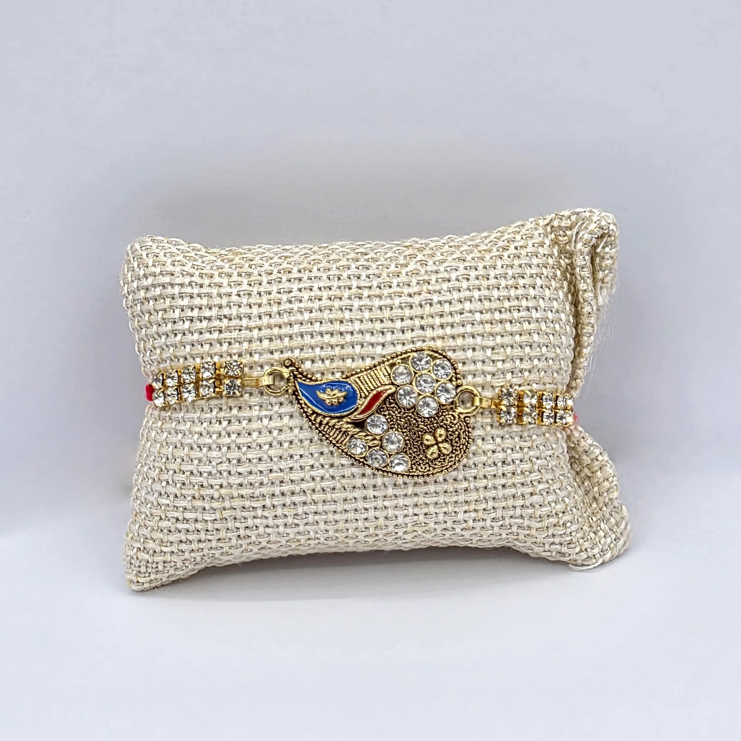 Elegant Rhinestone Peacock Rakhi - Golden Detail