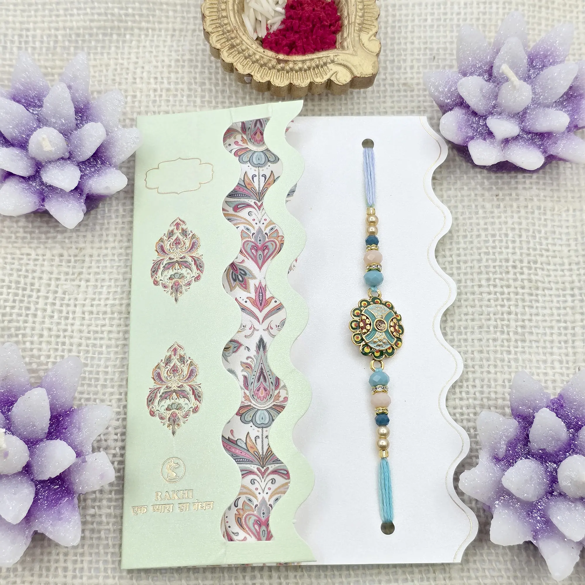 Exquisite Handcrafted Rakhi with Teal & Gold Embellishments