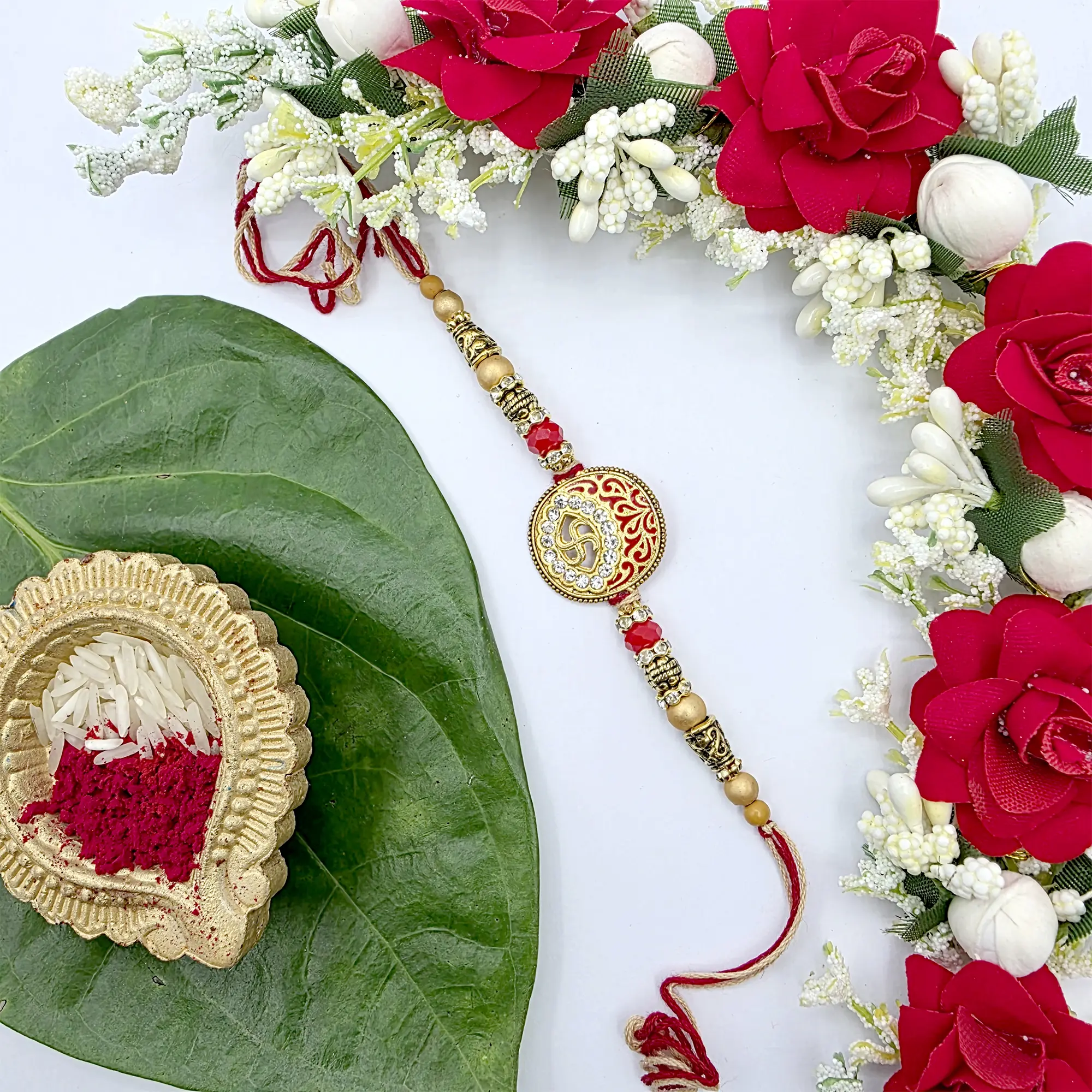 Exquisite Red and Gold Rakhi with Om Charm Rakhi