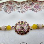 Handcrafted Rakhi with Floral Charm and Decorative Beads