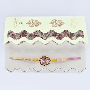 Handcrafted Rakhi with Floral Charm and Decorative Beads