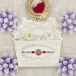 Rakhi with Pearl and Crystal Accents