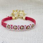 Traditional Red Thread Rakhi with Pearl and Gold Tassels
