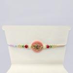 Elegant Beaded Rakhi with Ornamental Centerpiece