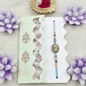 Exquisite Handcrafted Rakhi with Teal & Gold Embellishments