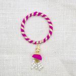 Handcrafted Pink and Gold Rakhi with Pearl Tassel