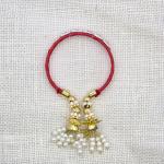 Traditional Red Thread Rakhi with Pearl and Gold Tassels
